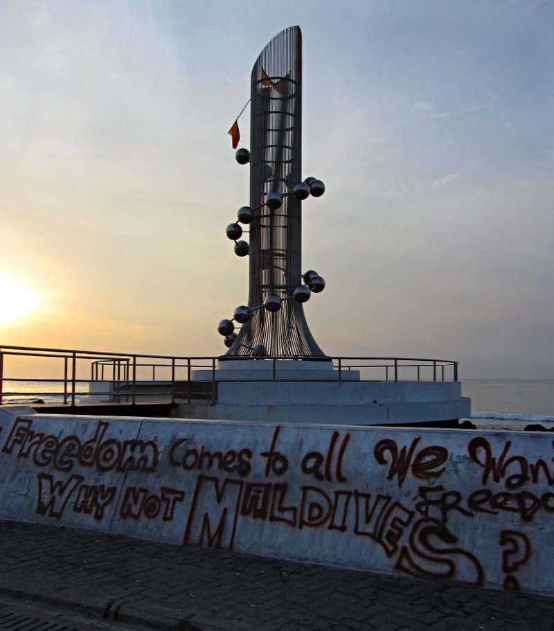 Displayed against the backdrop of the 2004 Tsunami monument, the message “Freedom come to all, Why not the Maldives?” is posed to the world. Photo: maldivesculture.com