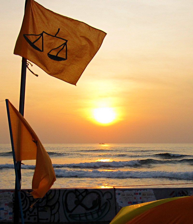 The scales of justice adorn the MDP flag at dawn in the MDP demonstration area on the eastern edge of Malé. Photo: maldivesculture.com