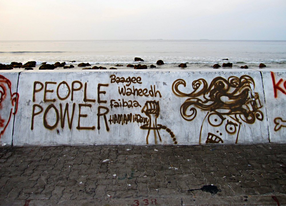 In the aftermath of the coup, there was an explosion of street art and political messages graffitied onto the seawall surrounding the island of Malé. Translation: “Traitor Waheed, go now.”